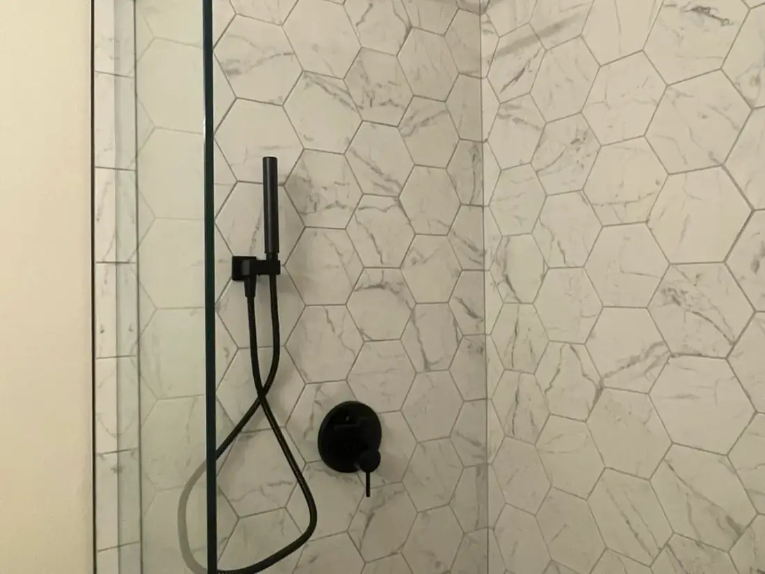 Hexagon marble tile walk-in shower with glass door Oregon