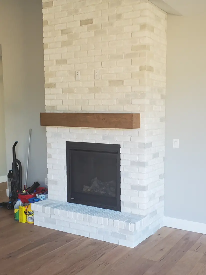 Finished cream stacked stone veneer fireplace with wood mantel Salem Oregon