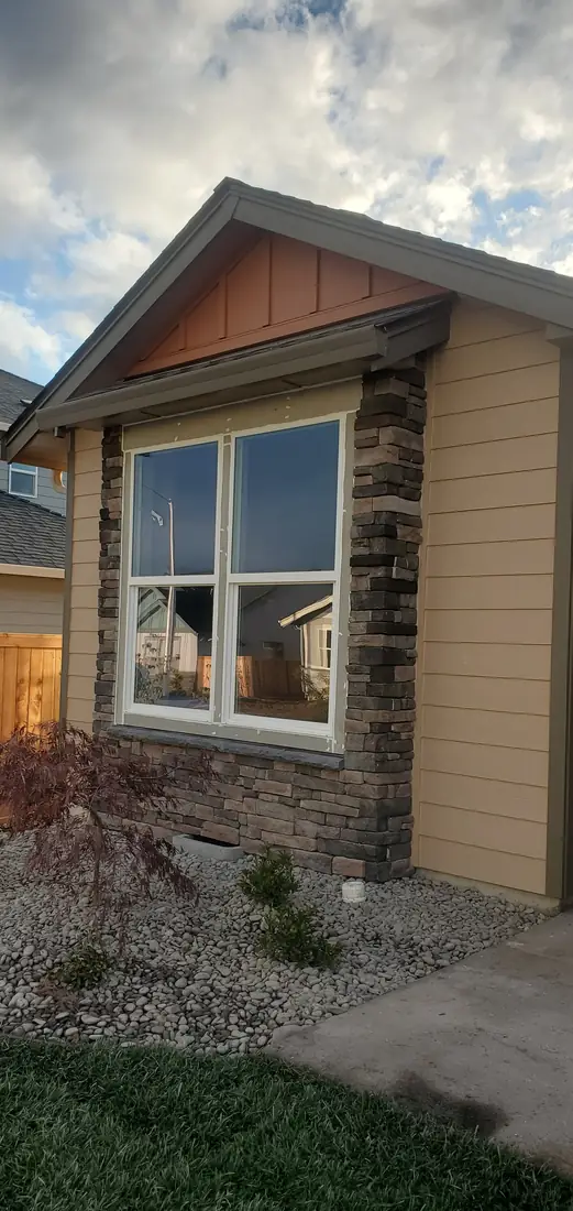 Stone veneer surround around exterior window Oregon home