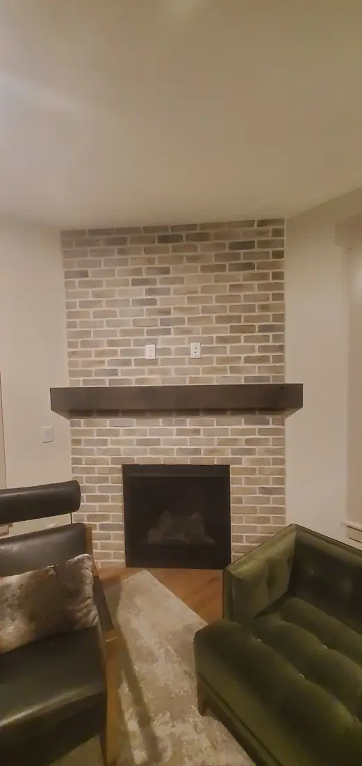 Mosaic tile fireplace surround with hardwood floor Oregon