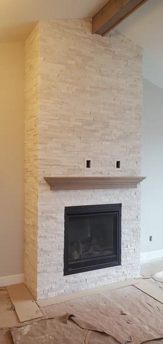 Stone veneer fireplace and chimney interior installation in progress Oregon