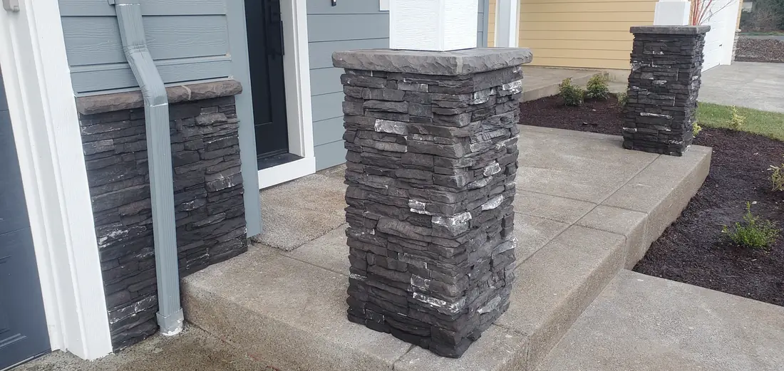 Dark gray stone veneer exterior columns on home Oregon