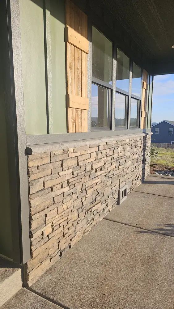 Stacked stone veneer hearth ledge installation in progress Oregon