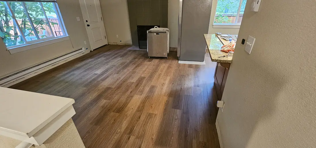 Refinished hardwood floor in open concept living area Oregon