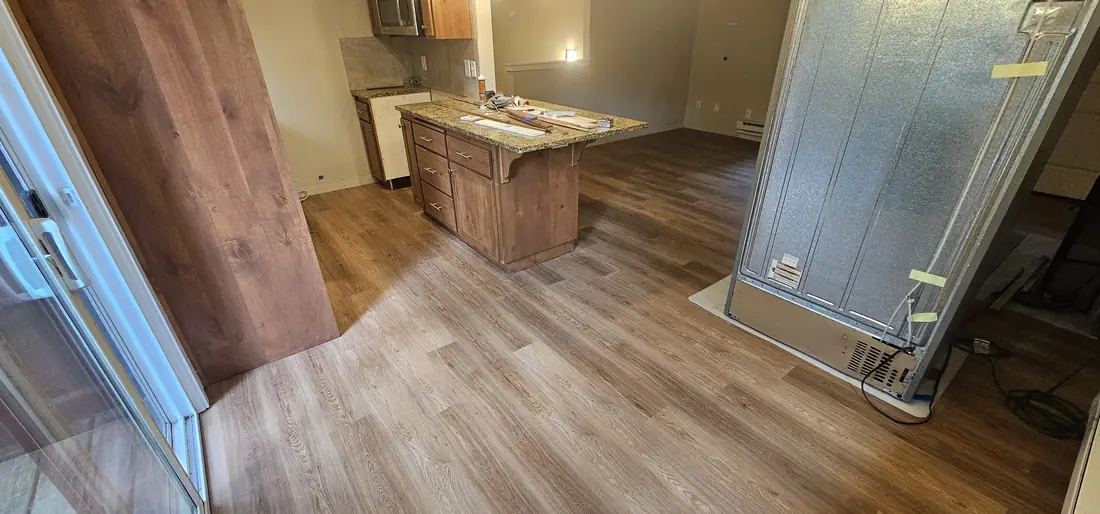 Hardwood flooring in hallway and kitchen with island Oregon
