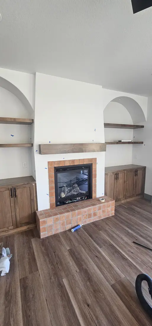 Waterfall countertop island installation with hardwood floor Oregon