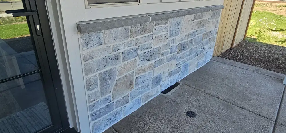 Stone veneer exterior accent wall with walkway Oregon home